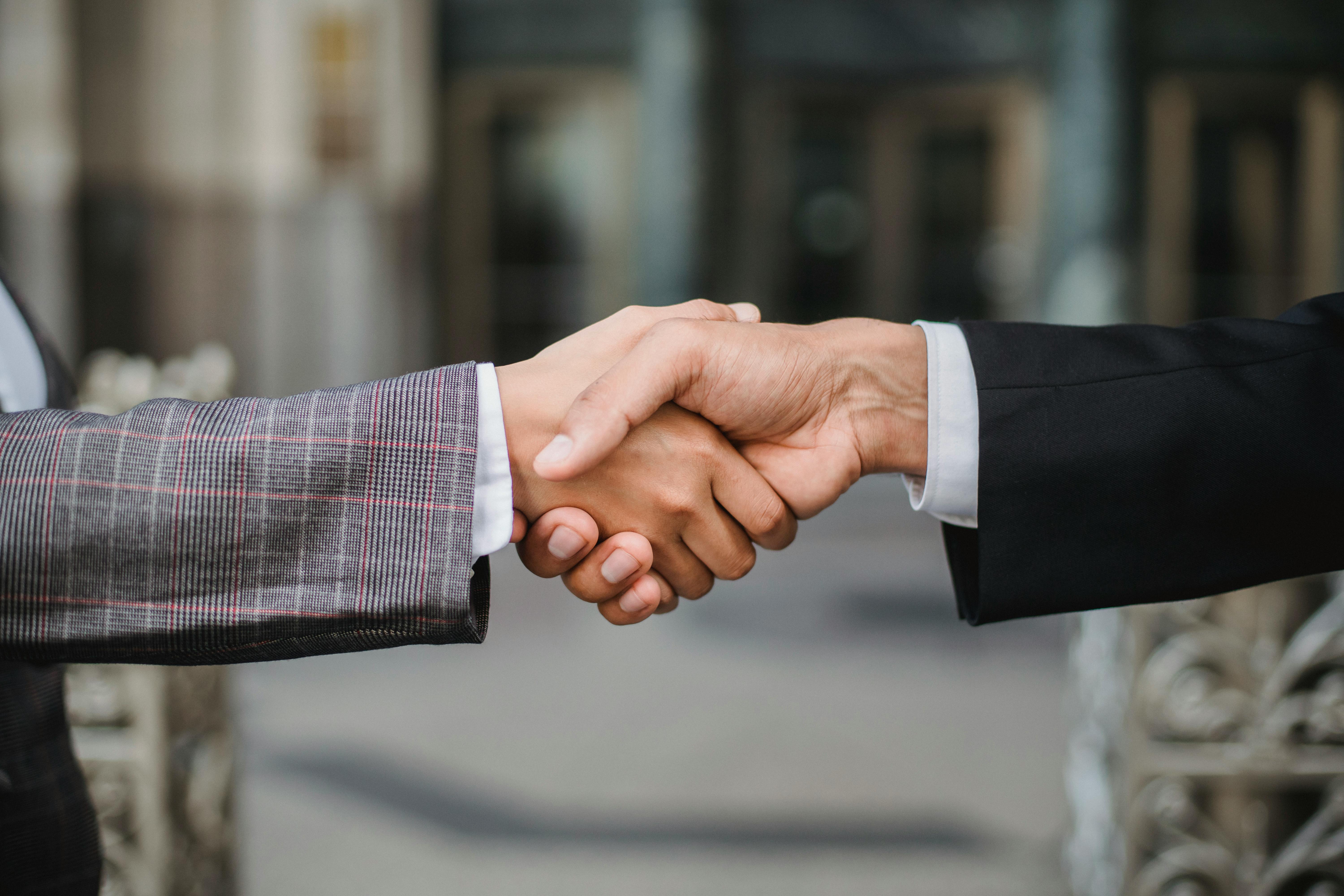 Business partnership handshake